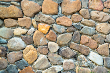 The walls are made with large stones, durable.