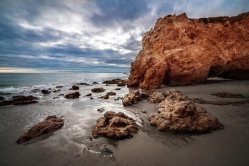Scenic rocks at sunset time at El Matador Ocean Beach in Malibu, California