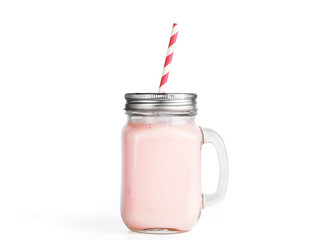 Pink strawberry smoothie in mason jar glass. Isolated on white with clipping path.
