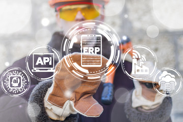 Manufacturing engineer pressing ERP smartphone button on a virtual screen. Mobile Enterprise...