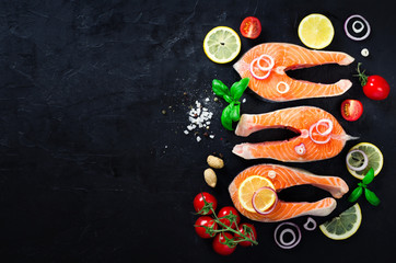 Raw fresh salmon steak with vegetables. Ingredients for cooking on brown background. Space for text. Diet and healthy food concept. Banner