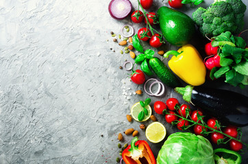 Set of fresh vegetables on grey background. Aromatic herbs, onion, avocado, broccoli, pepper bell, eggplant, cabbage, radish, cucumber, almonds, rucola, baby corn. Banner