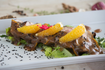 Roasted duck breast with oranges and orange sauce