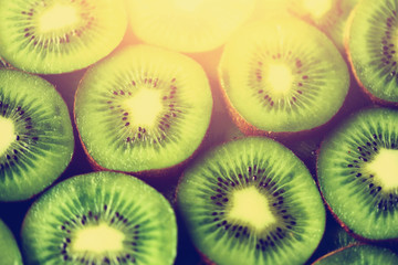 Fresh organic kiwi fruit sliced. Food frame with copy space for your text. Banner. Green kiwi circles background