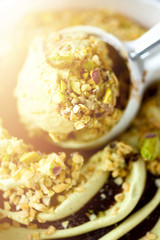 Scooped pistachio ice cream background. Summer food concept, copy space, top view. Sweet yogurt dessert or green tea ice-cream texture.