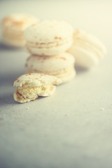 Vanilla caramel macarons, copy space. Holidays and celebrations concept. Sweet gift for woman, girl.