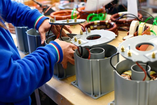Man working on new electrical transformers