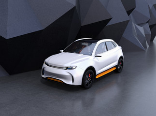 White self-driving electric SUV on black geometric background. 3D rendering image.