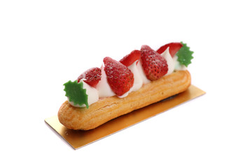 Choux cream with strawberry isolated in white background