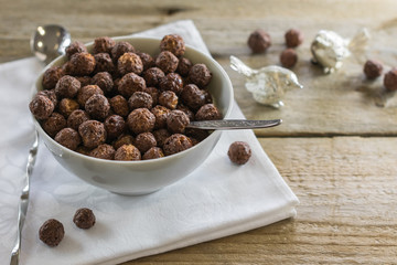 Cereal. Cocoa balls with milk for breakfast.