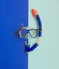 Blue Diving Mask and Snorkel on blue Background. Diving equipment.