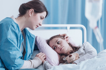 Mother comforting daughter