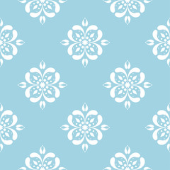 White floral seamless design on blue background