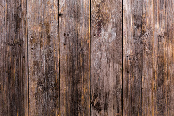 The old natural wooden boards are dark brown with a beautiful deep clear texture