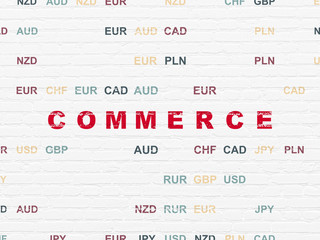 Finance concept: Painted red text Commerce on White Brick wall background with Currency