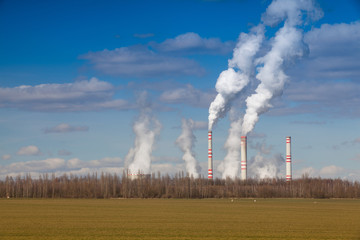 A coal-fired power station in spring  agricultural landscape. Czech republic