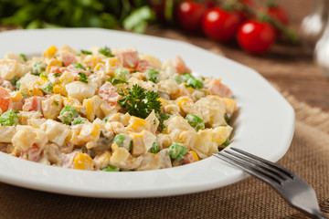 Traditional salad with cooked vegetables with mayonnaise.