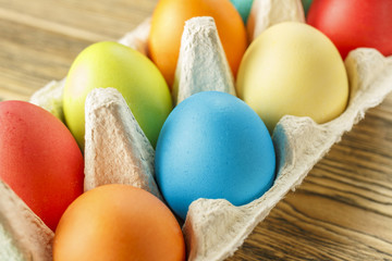 Bright Easter eggs in a special stand. Happy Easter. Close-up, blurred background. The texture of the shell.