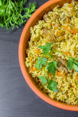 Pilaf with beef, carrots, onions, garlic, pepper and cumin. A traditional dish of Asian cuisine.