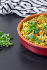 Pilaf with beef, carrots, onions, garlic, pepper and cumin. A traditional dish of Asian cuisine.