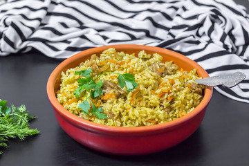 Pilaf with beef, carrots, onions, garlic, pepper and cumin. A traditional dish of Asian cuisine.