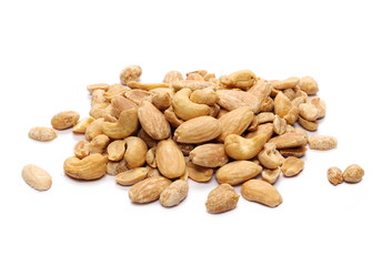 Mix of roasted, salted peanuts, cashew nuts and almonds isolated on white background