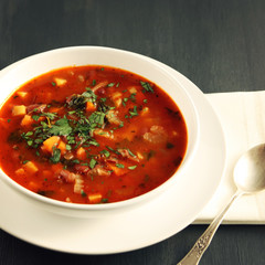 Tomato soup with red beans, potato and carrot. Vegan diet. European cuisine. Vegetarian dish. Main course. Organic meal. Toned photo.