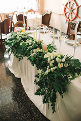 wedding decoration with elements vases wedding arch of greenery of white roses