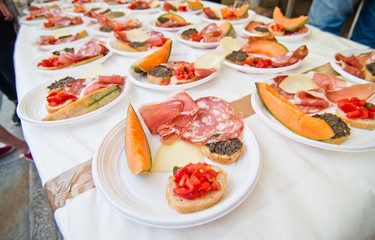 real Italian antipasto with cold cuts, ham, croutons, cheese and melon