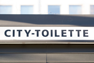 Sign of public portable city toilette