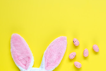 Easter holiday background with bunny ears and easter eggs