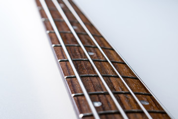 Frets on bass guitar. Close up. Vintage old retro bass in studio