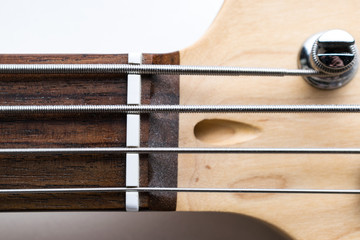 Frets on bass guitar. Close up. Vintage old retro bass in studio