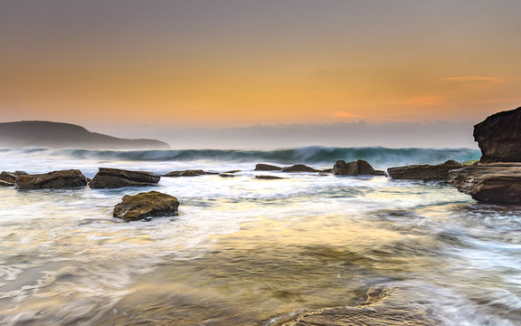 Hazy Dawn Seascape with Rocks