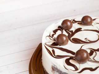 Delicious easy ice cream cake with chocolate on a light background