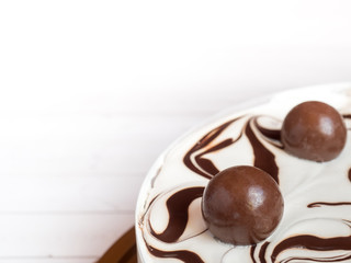 Delicious easy ice cream cake with chocolate on a light background