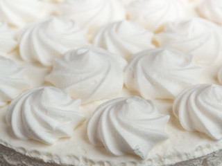 Obraz na płótnie Canvas Delicious light ice cream cake with roses cream Background