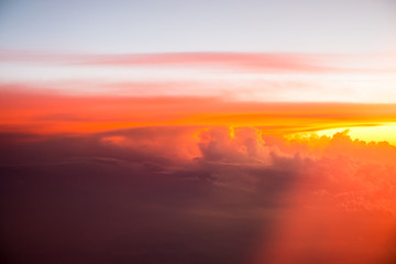 Red clouds on the sky. Top view from the plane