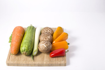 Fresh Vegetables in wooden box on white background