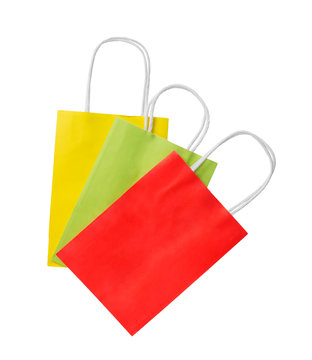 three shopping bags. Red, green and yellow color pacage on white background
