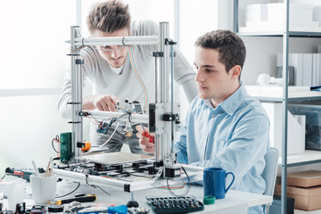 Young students using a 3D printer