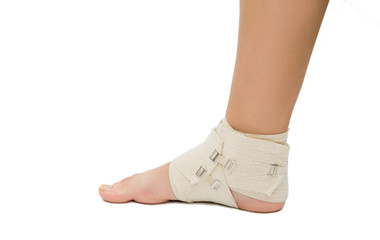 injured ankle with elastic bandage isolate on a white background