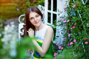 Portrait of an attractive girl in a summer garden