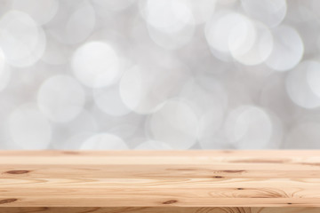 blur white bokeh background with wooden table space for display products design