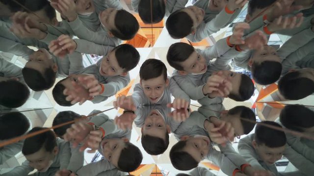 Child in a kaleidoscope tunnel. Glance into infinity