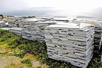 Big piles of marble stone tiles in Tinos island, Greece.