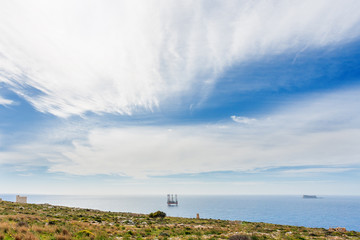Fototapeta na wymiar Gas extraction platform. Seascape in sunny day from Gozo island, Malta.