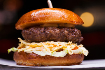 Tasty grilled prawn and beef burger with lettuce