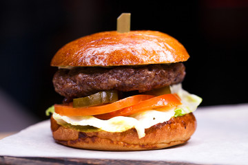 Tasty grilled prawn and beef burger with lettuce