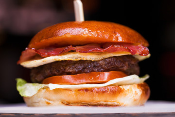 Tasty grilled prawn and beef burger with lettuce